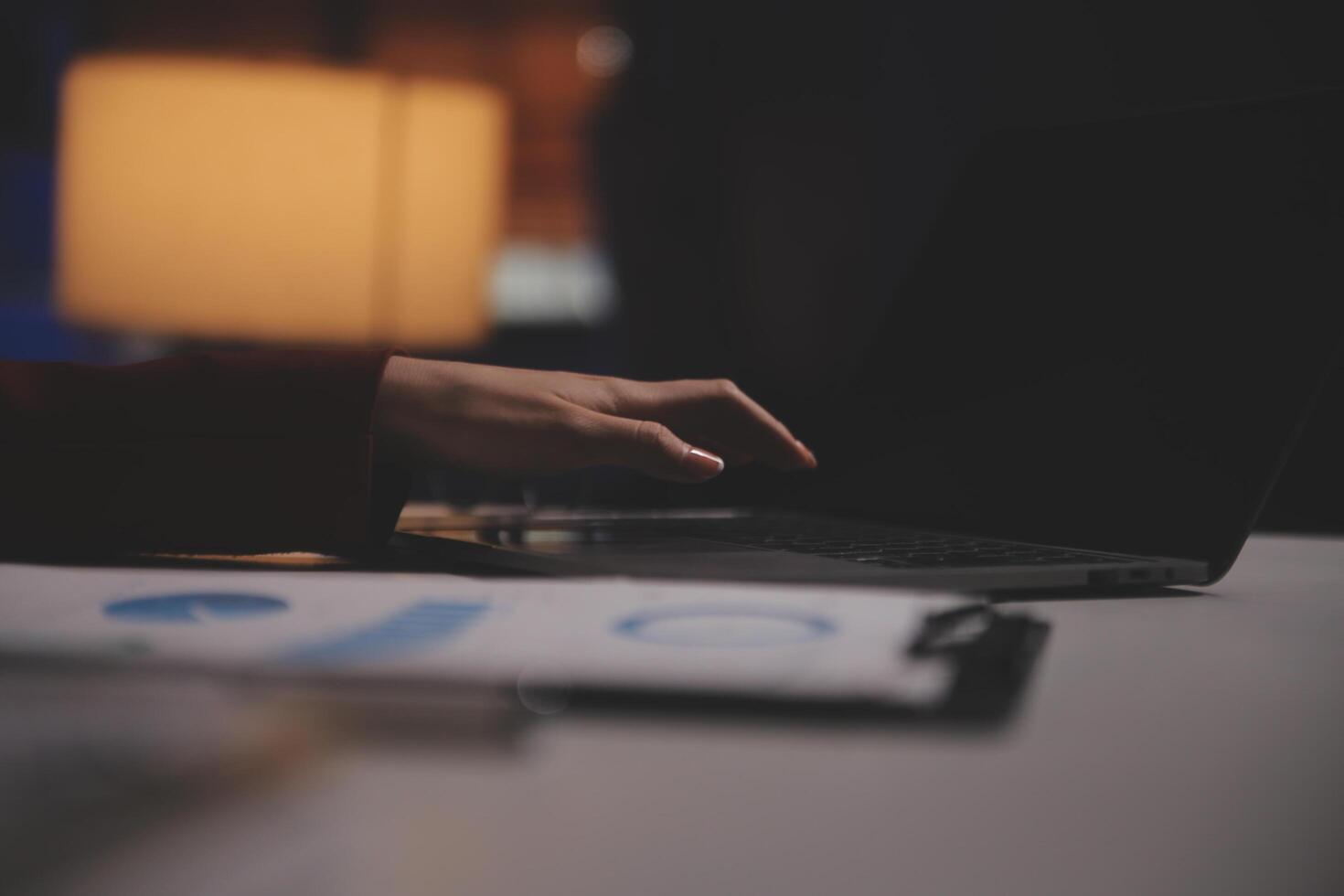 Business woman using calculator for do math finance on wooden desk in office and business working background, tax, accounting, statistics and analytic research concept photo