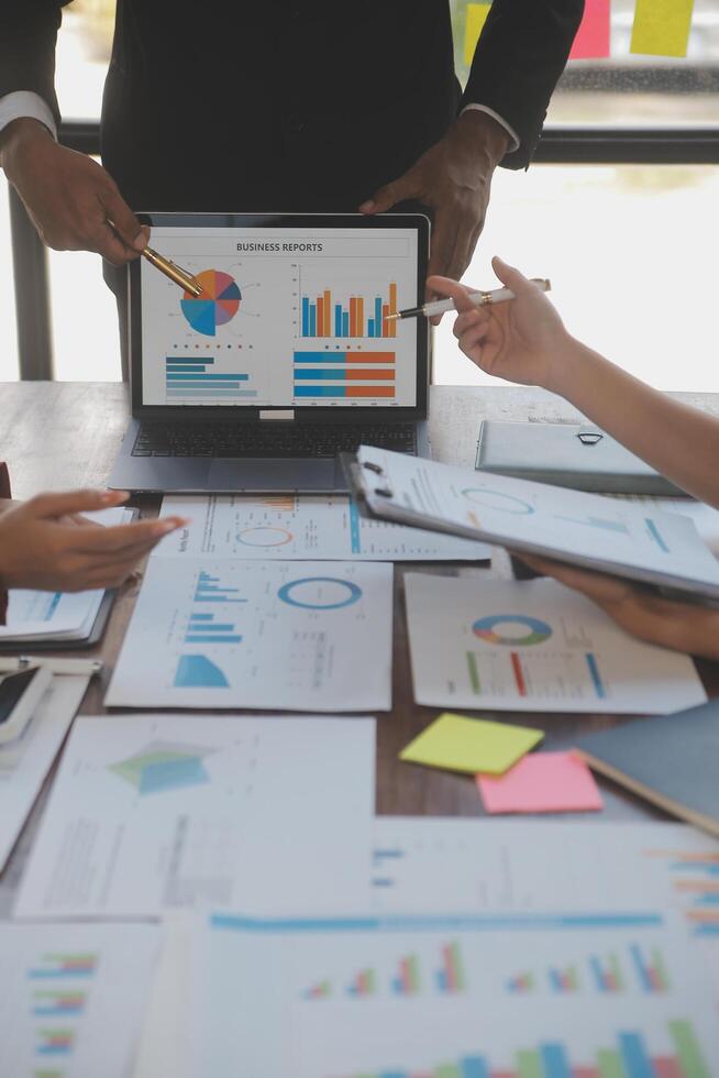 Finance manager meeting discussing company growth project success financial statistics, professional investor working start up project for strategy plan with document, laptop and digital tablet. photo