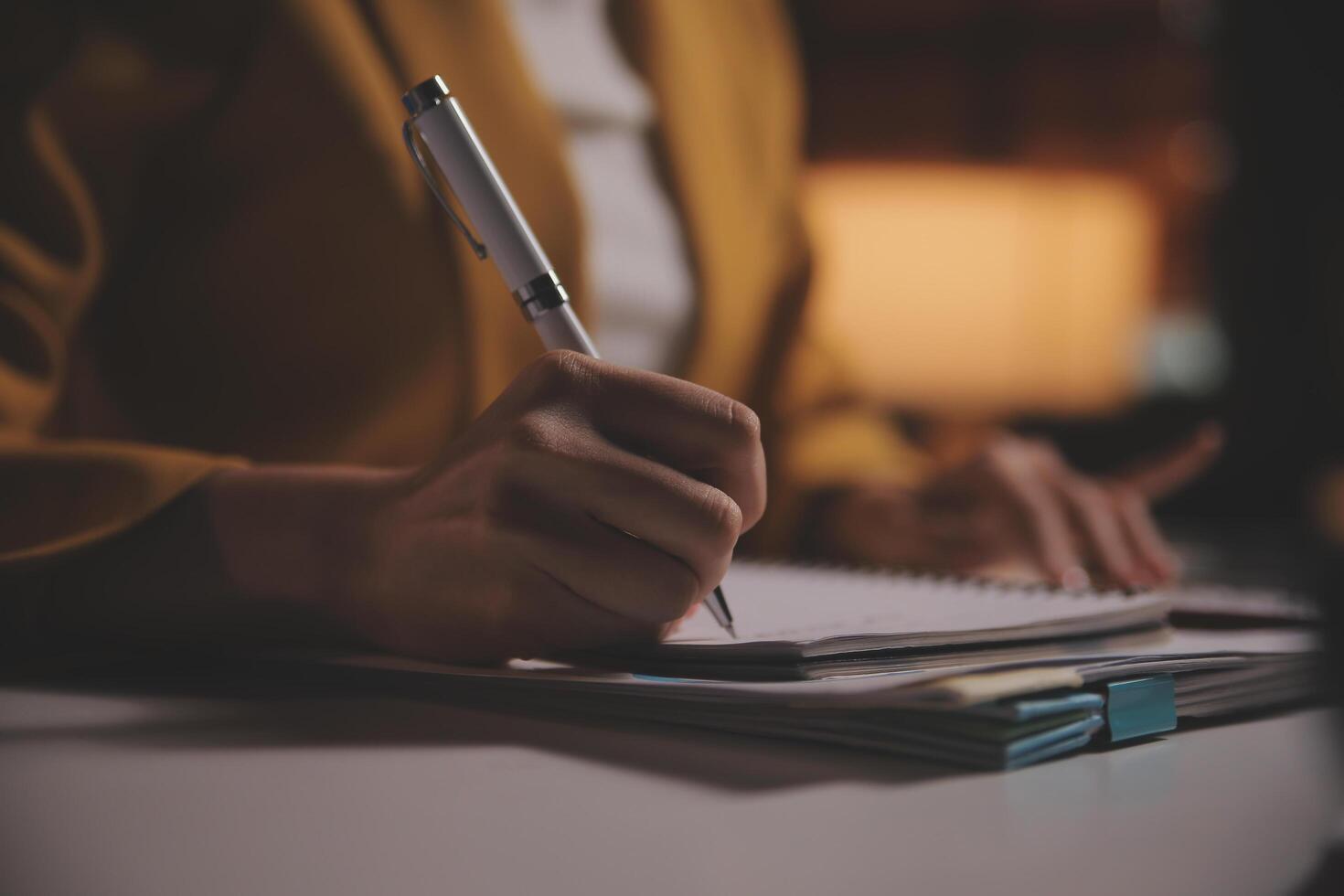 Business woman using calculator for do math finance on wooden desk in office and business working background, tax, accounting, statistics and analytic research concept photo