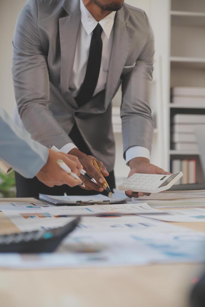Finance manager meeting discussing company growth project success financial statistics, professional investor working start up project for strategy plan with document, laptop and digital tablet. photo