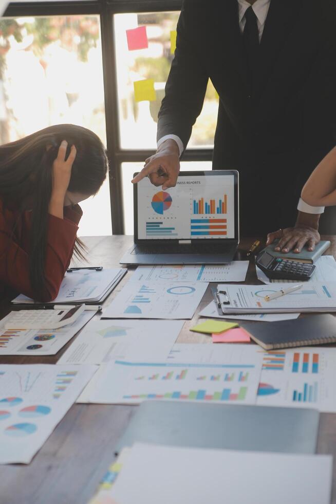 Frustrated upset multiracial business team people sad with bad work result in report disappointed in corporate bankruptcy failure crisis worried of paperwork problem sit at table at office meeting photo