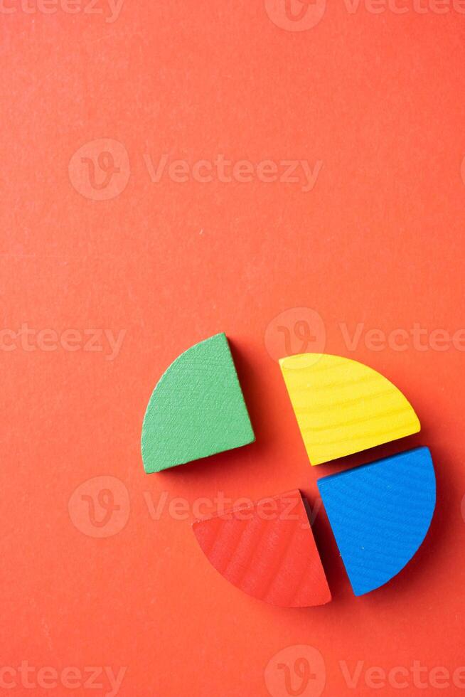 Colorful wooden pie chart pieces photo