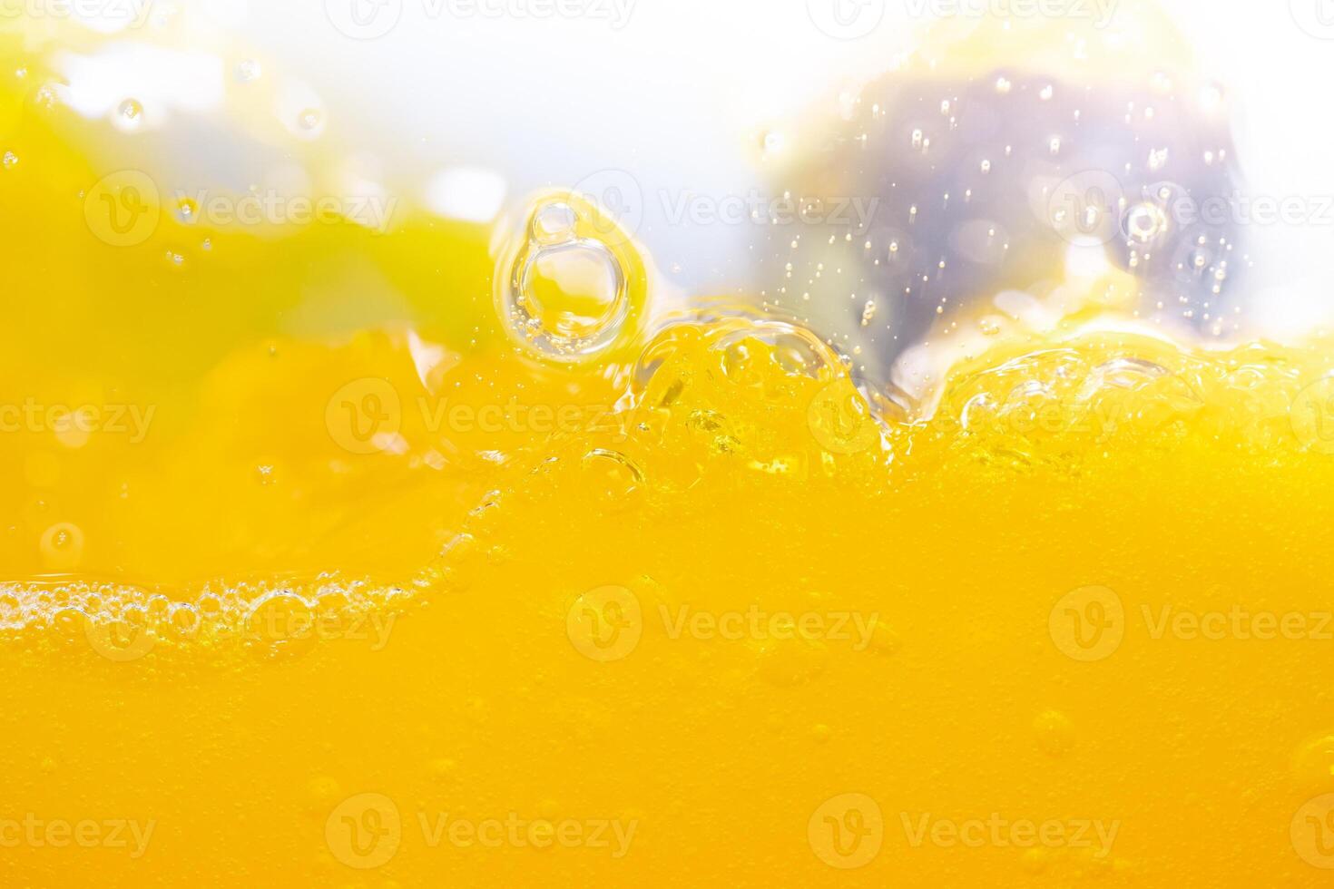 Close up bright orange juice splash texture for health and nature waves, Beautiful waves curve and little bubbles smooth for garphic design and background photo