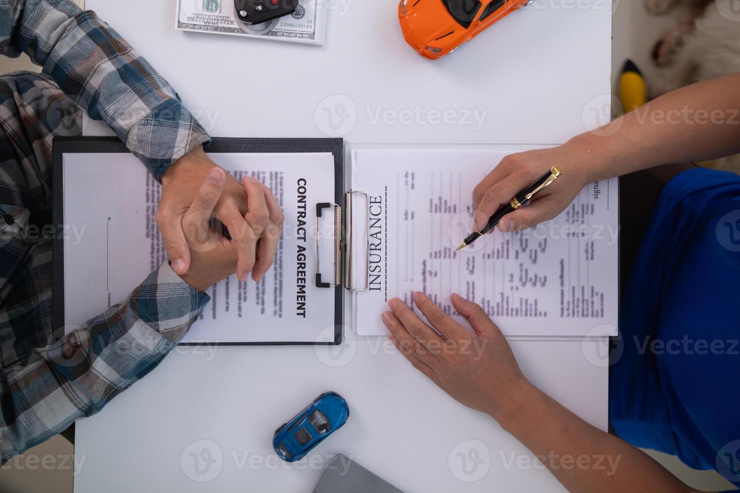 Car dealers recommend car to customers before entering into sales contracts so that customers can get the car they like before paying contract money. Concept of making sales contract with distributor photo