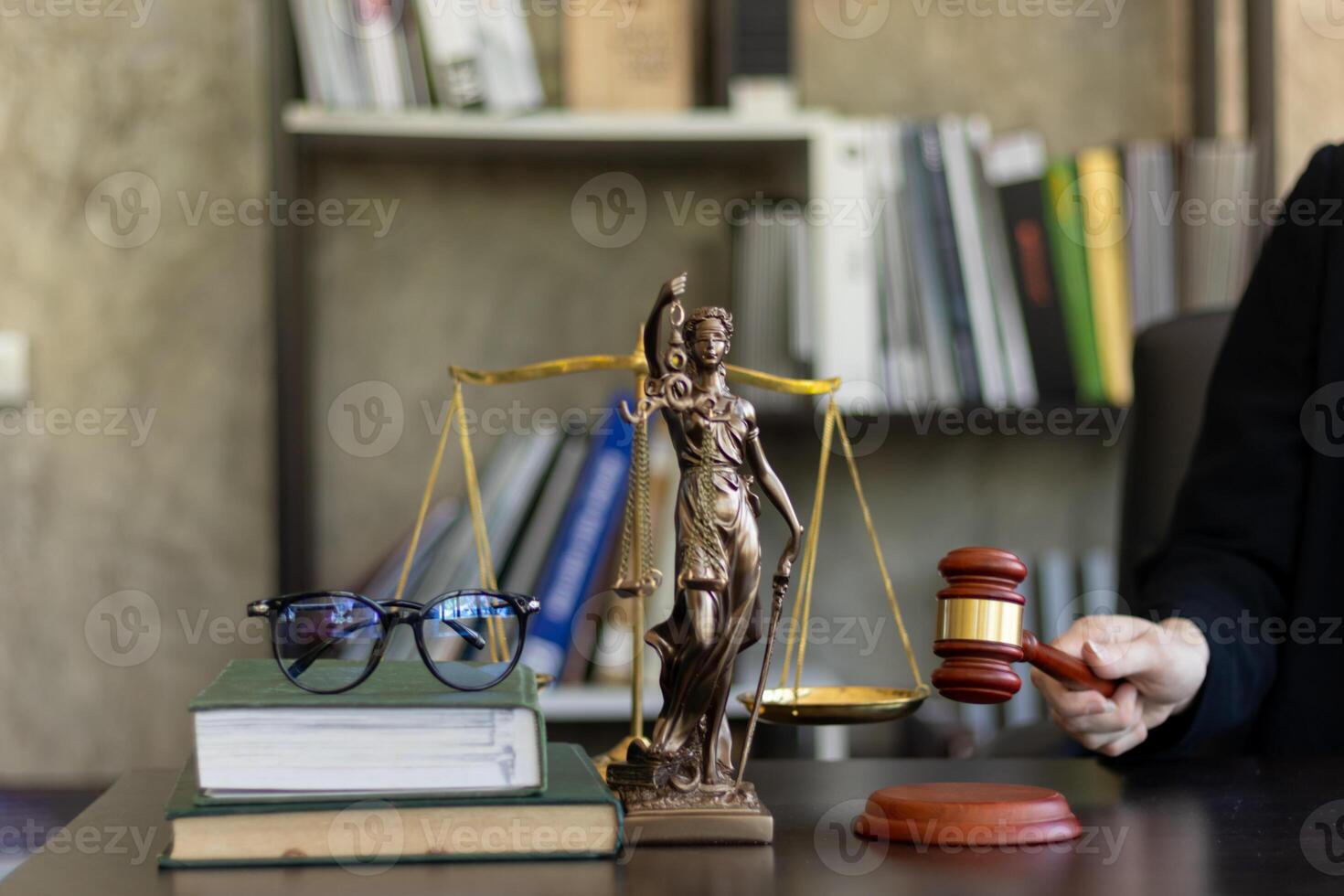 judge holds givel wood tapped on the wooden base to read verdict for victims and defendants to know the verdict obtained from the evidence and the lawyer's defense of the case. court decision concept photo