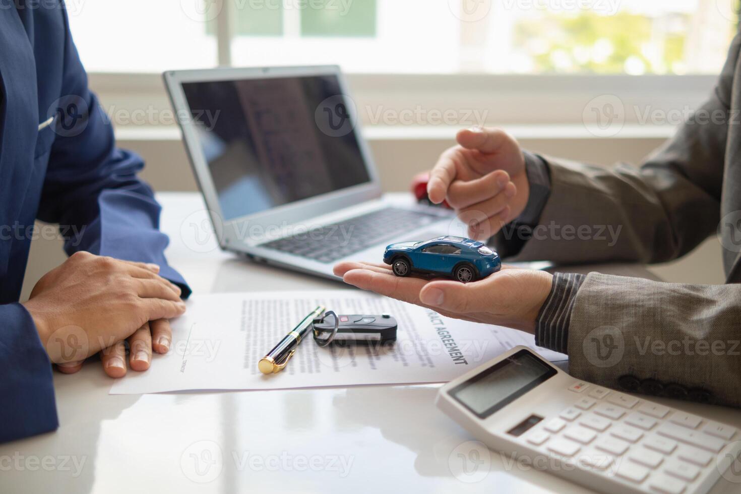 Car dealers recommend car to customers before entering into sales contracts so that customers can get the car they like before paying contract money. Concept of making sales contract with distributor photo