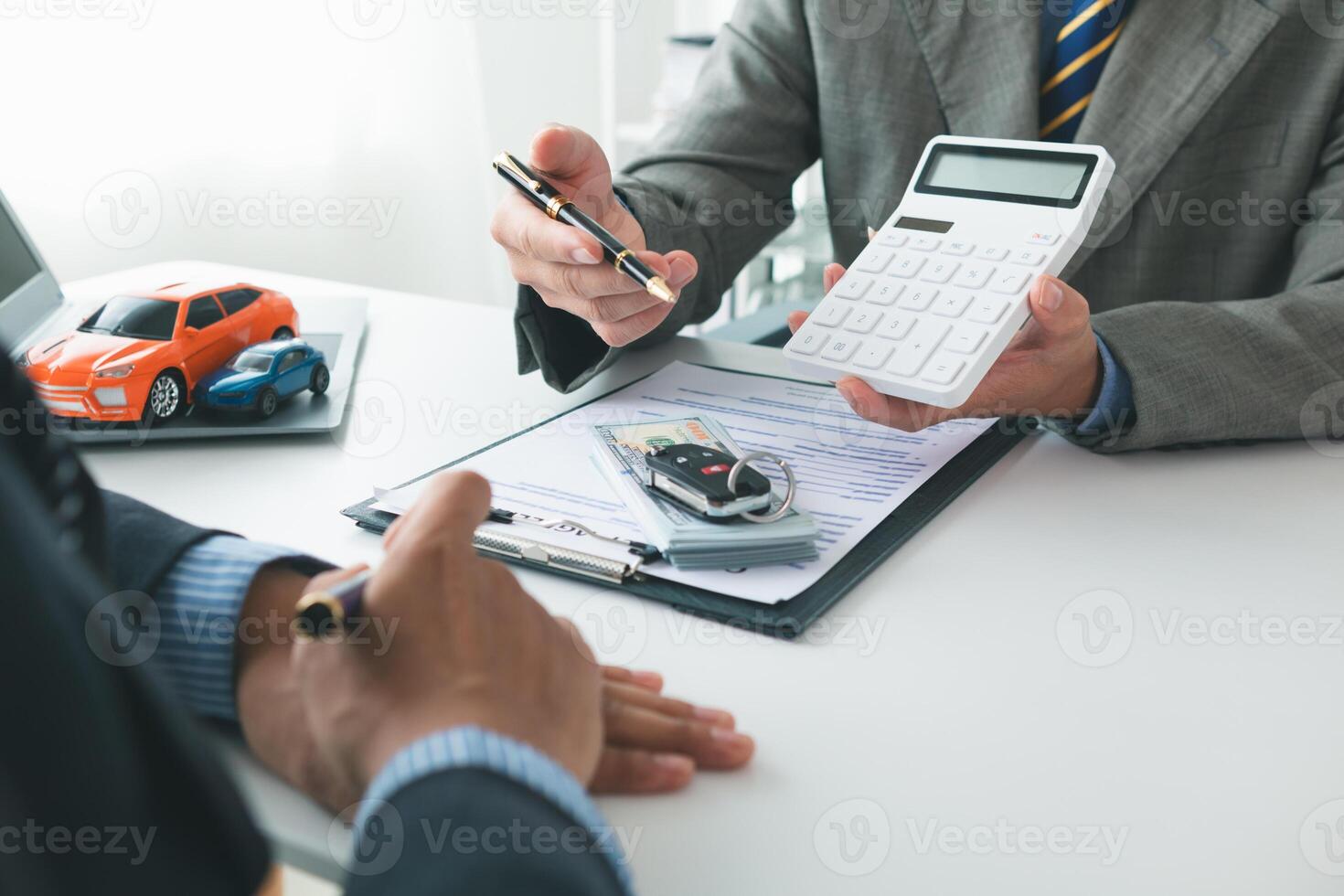 Car dealers recommend car to customers before entering into sales contracts so that customers can get the car they like before paying contract money. Concept of making sales contract with distributor photo