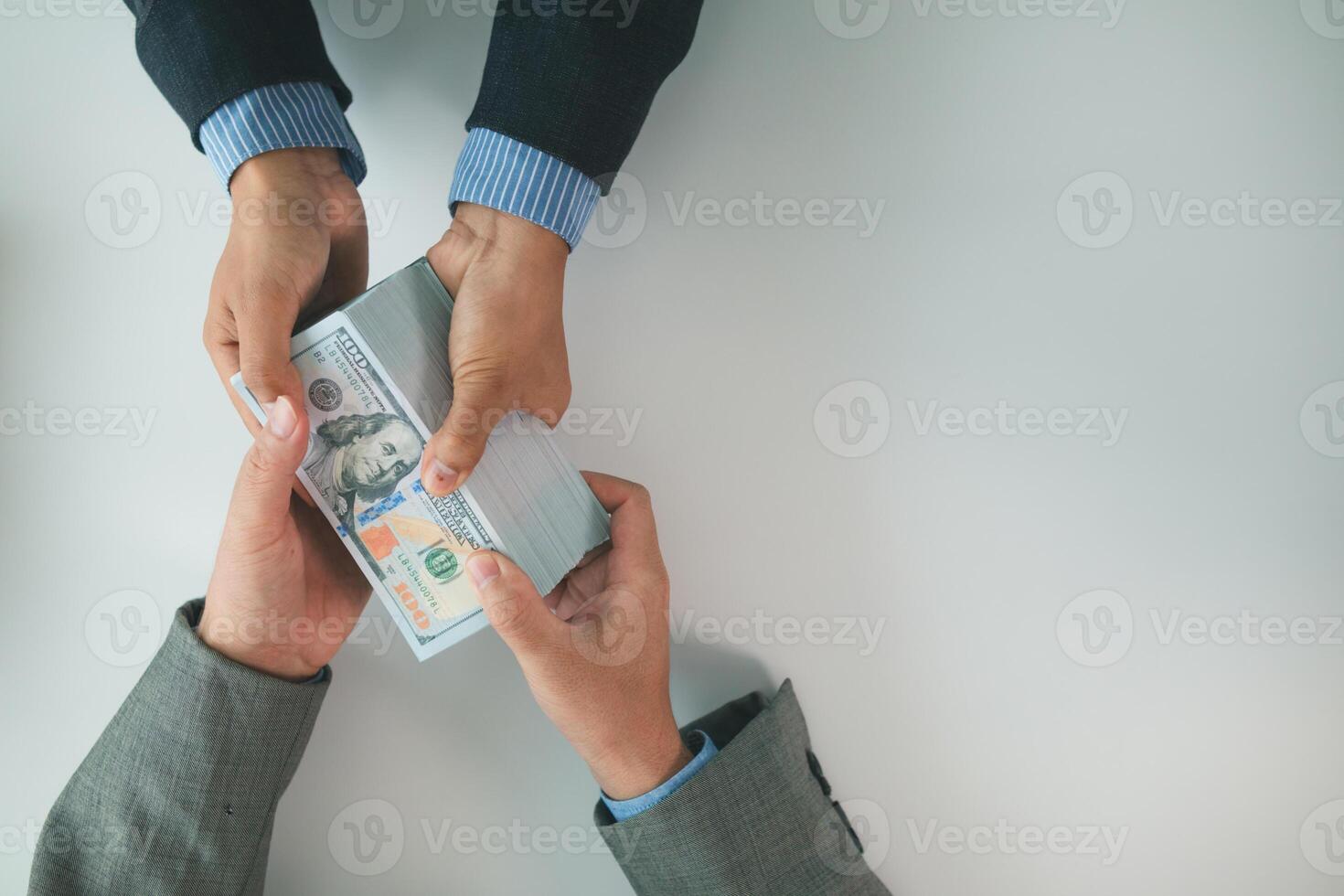 Real estate brokers are bribing government officials with cash issue construction permits in areas where high rise buildings are prohibited. Concept bribing government officials to facilitate business photo