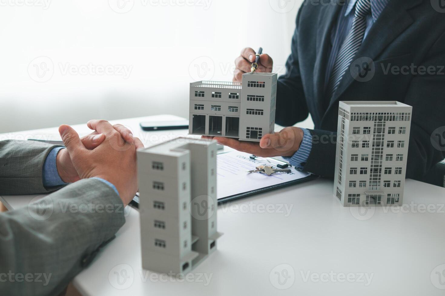 Real estate agents are selling real estate clients and offering condominiums buyers as long term rental investments help reduce burden paying installments. Investment property trading long term rental photo