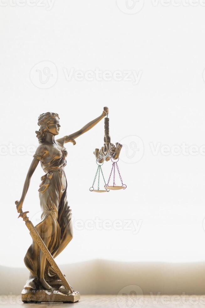 statue of god Themis Lady Justice is used as symbol of justice within law firm demonstrate truthfulness of facts and power to judge without prejudice. hemis Lady Justice symbol of honesty and justice. photo