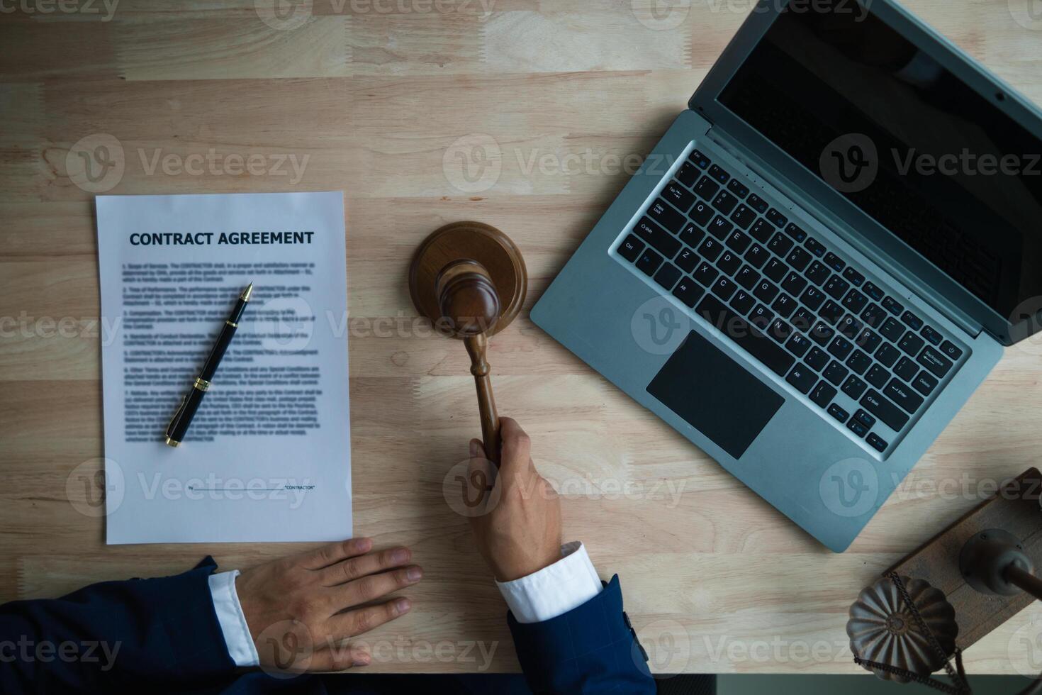 judge holds givel wood tapped on the wooden base to read verdict for victims and defendants to know the verdict obtained from the evidence and the lawyer's defense of the case. court decision concept photo