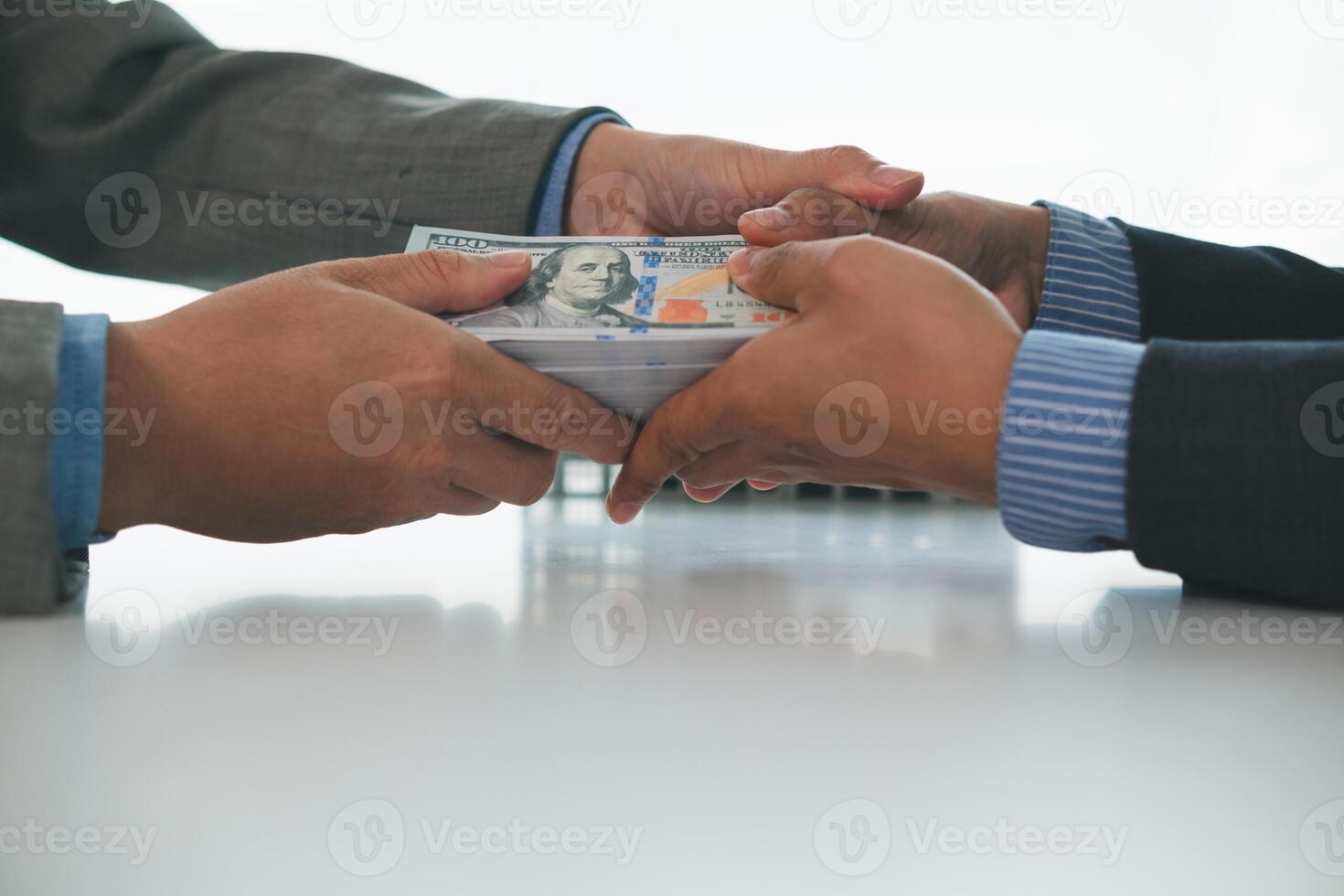 Real estate brokers are bribing government officials with cash issue construction permits in areas where high rise buildings are prohibited. Concept bribing government officials to facilitate business photo