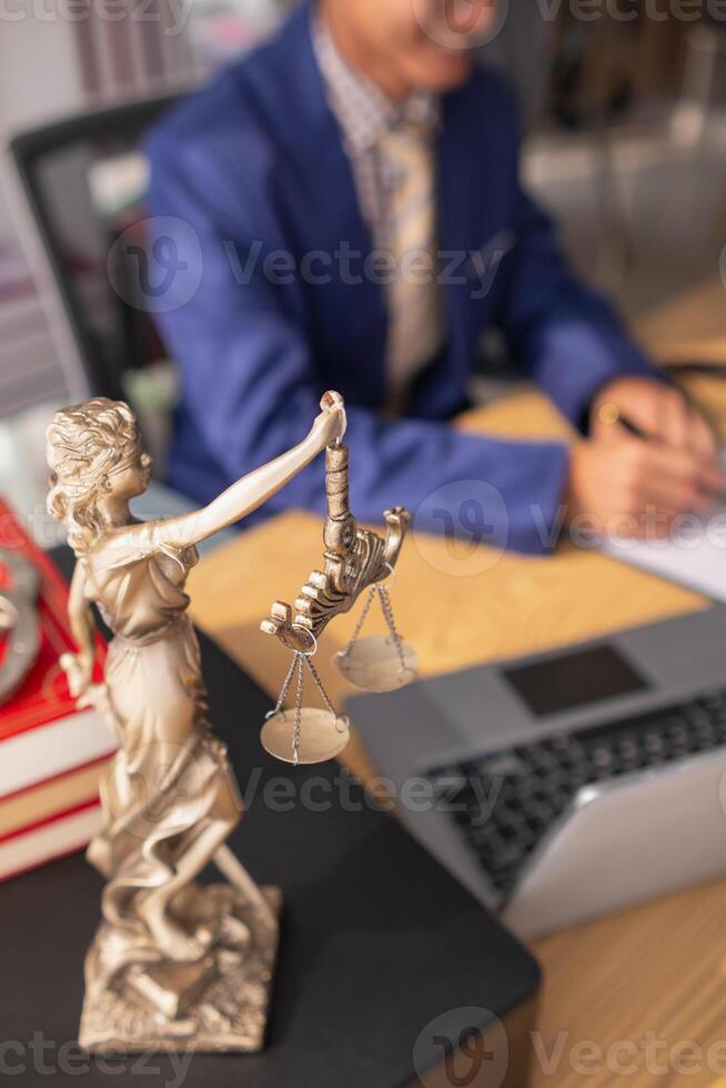 statue of god Themis Lady Justice is used as symbol of justice within law firm demonstrate truthfulness of facts and power to judge without prejudice. hemis Lady Justice symbol of honesty and justice. photo