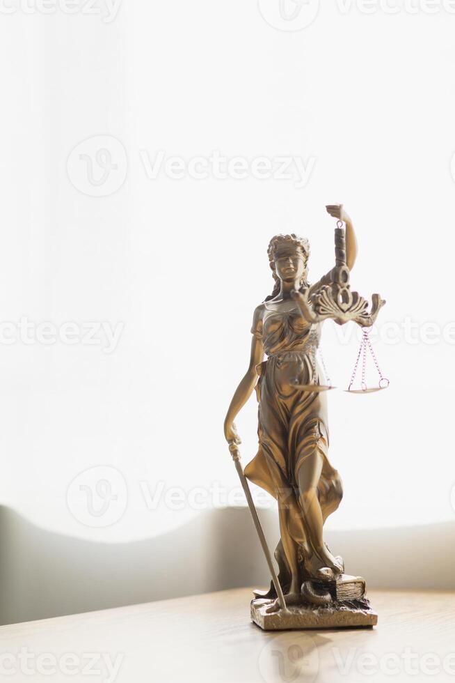 statue of god Themis Lady Justice is used as symbol of justice within law firm demonstrate truthfulness of facts and power to judge without prejudice. hemis Lady Justice symbol of honesty and justice. photo