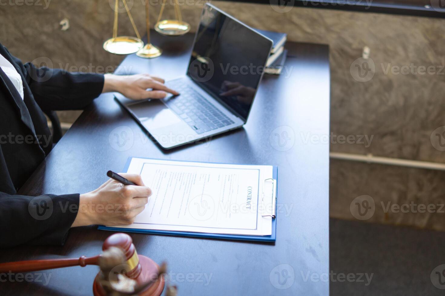 contract was placed on table inside legal counsel's office, ready for investors to sign the contract to hire a team of lawyers to provide legal advice for their investment. legal consulting concept photo