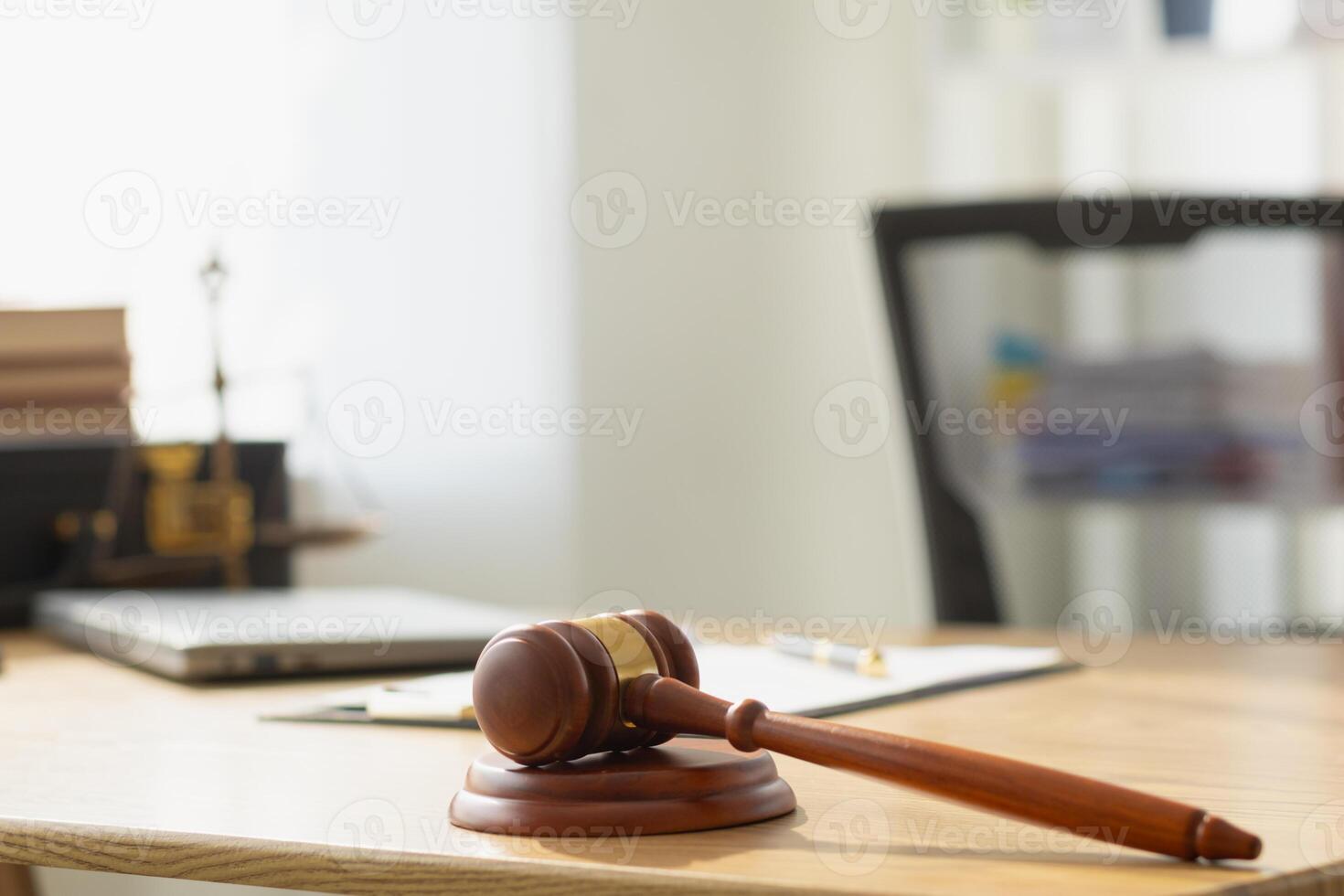 A judge gavel is prepared in the courtroom to be used to give a signal when the verdict is read after the trial is completed. Concept judge gavel is prepared to symbolize the decision in a court case. photo