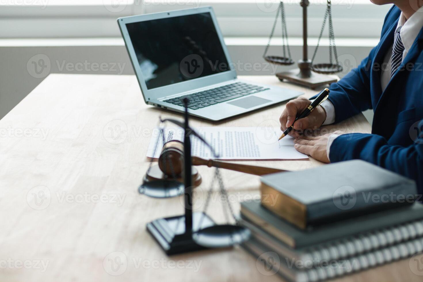 contract was placed on table inside legal counsel's office, ready for investors to sign the contract to hire a team of lawyers to provide legal advice for their investment. legal consulting concept photo