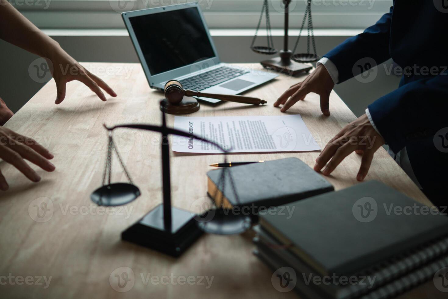 contract was placed on table inside legal counsel's office, ready for investors to sign the contract to hire a team of lawyers to provide legal advice for their investment. legal consulting concept photo