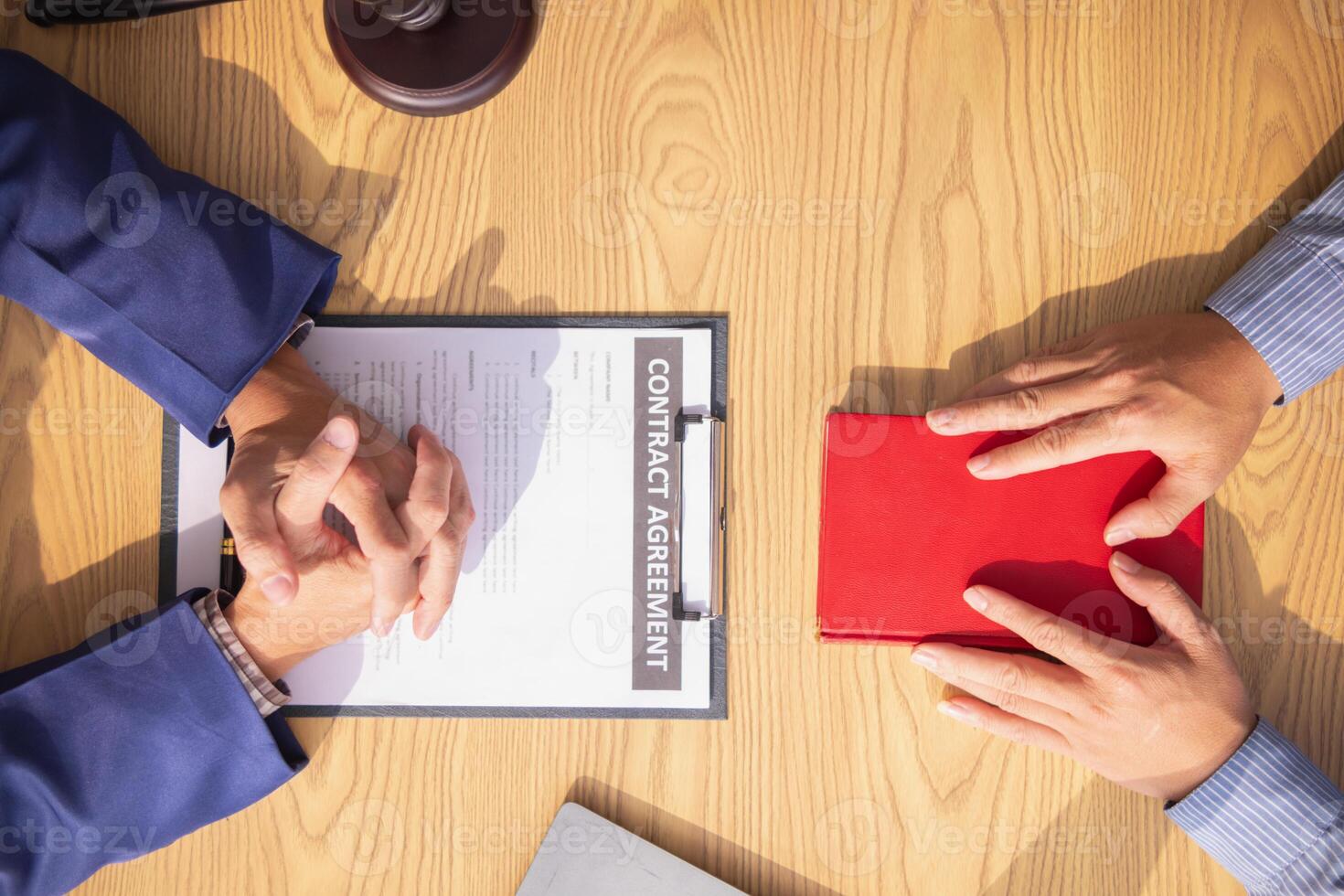 A Bible is placed on a table in a lawyer's office so that his client can swear before the Bible that his testimony will be truthful in order to be used in legal investigations and resolutions. photo