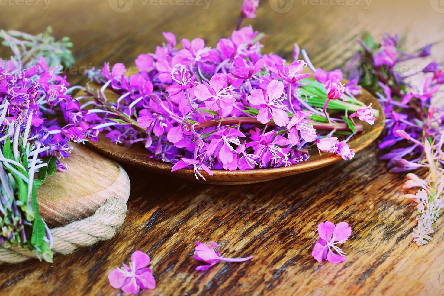 Flower Willowherb - Epilobium Angustifolium on wooden background. Top view photo