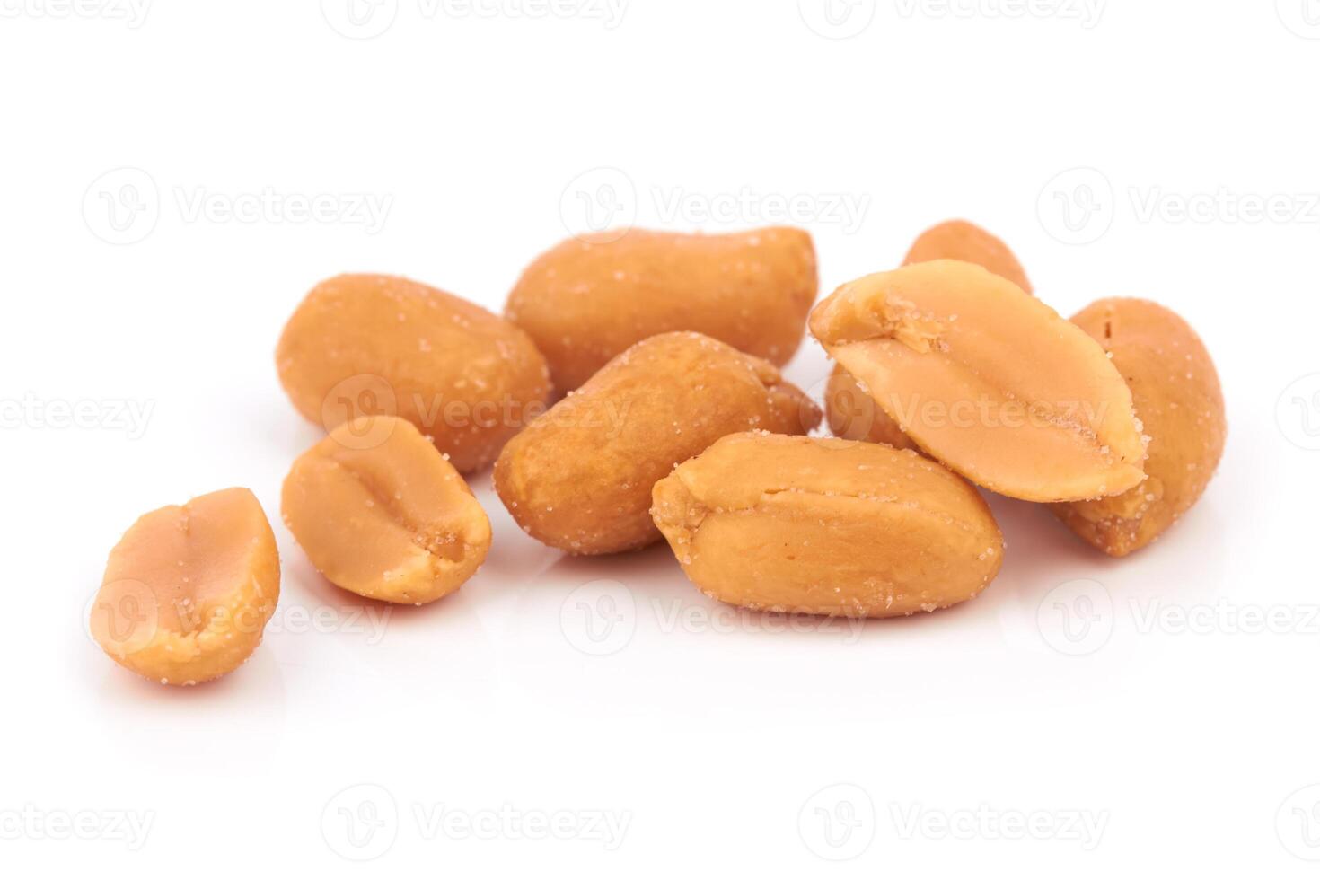 salted peanuts on white photo