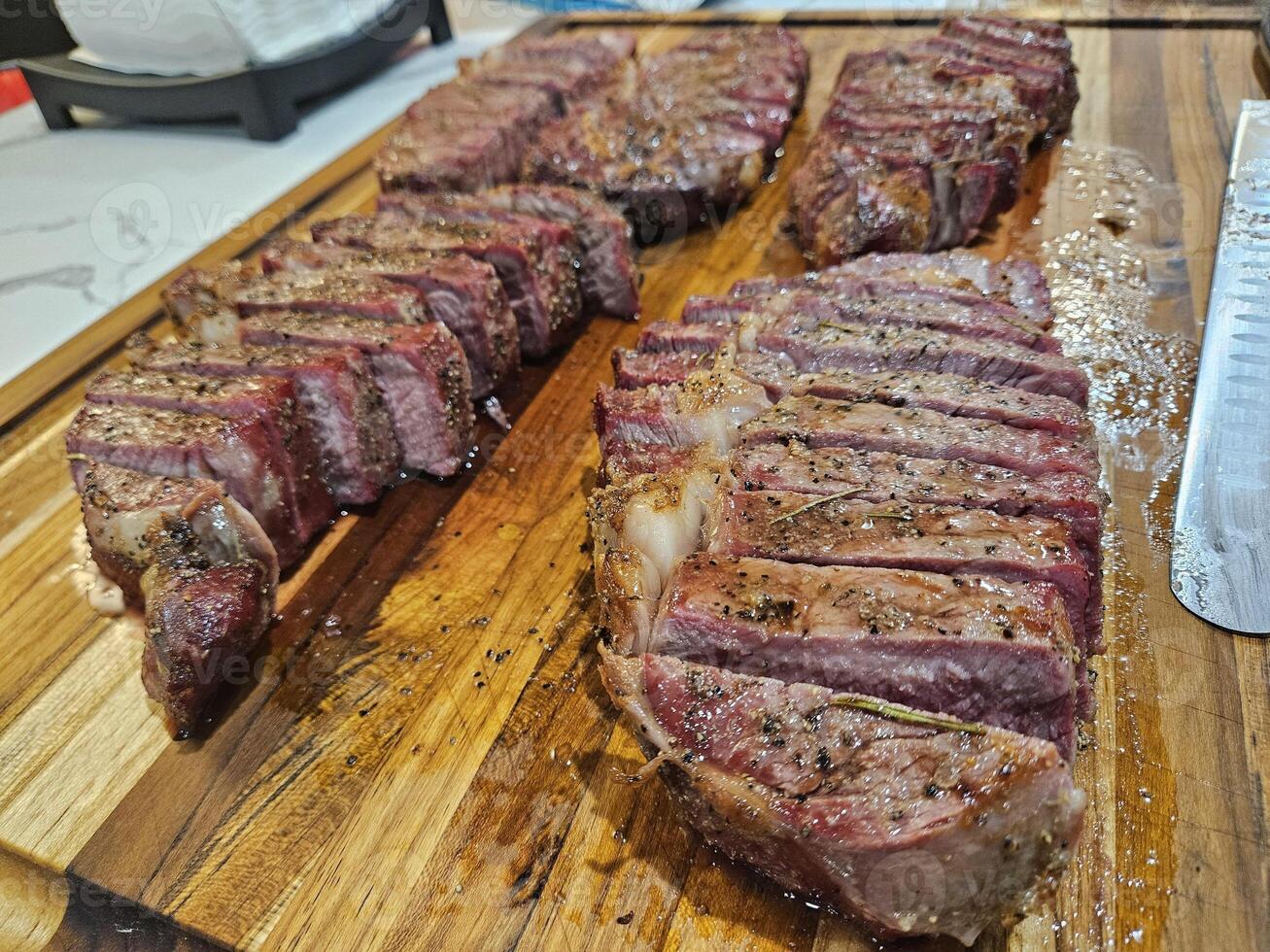 One month aged prime rib eye Steak smoked and seared with salt pepper garlic seasoning photo