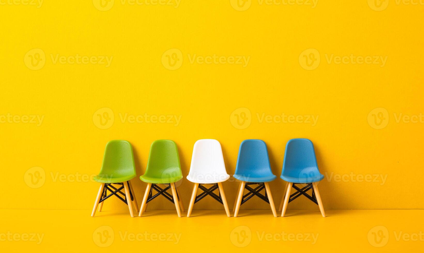 whIte chair standing out from the crowd. Business concept. photo