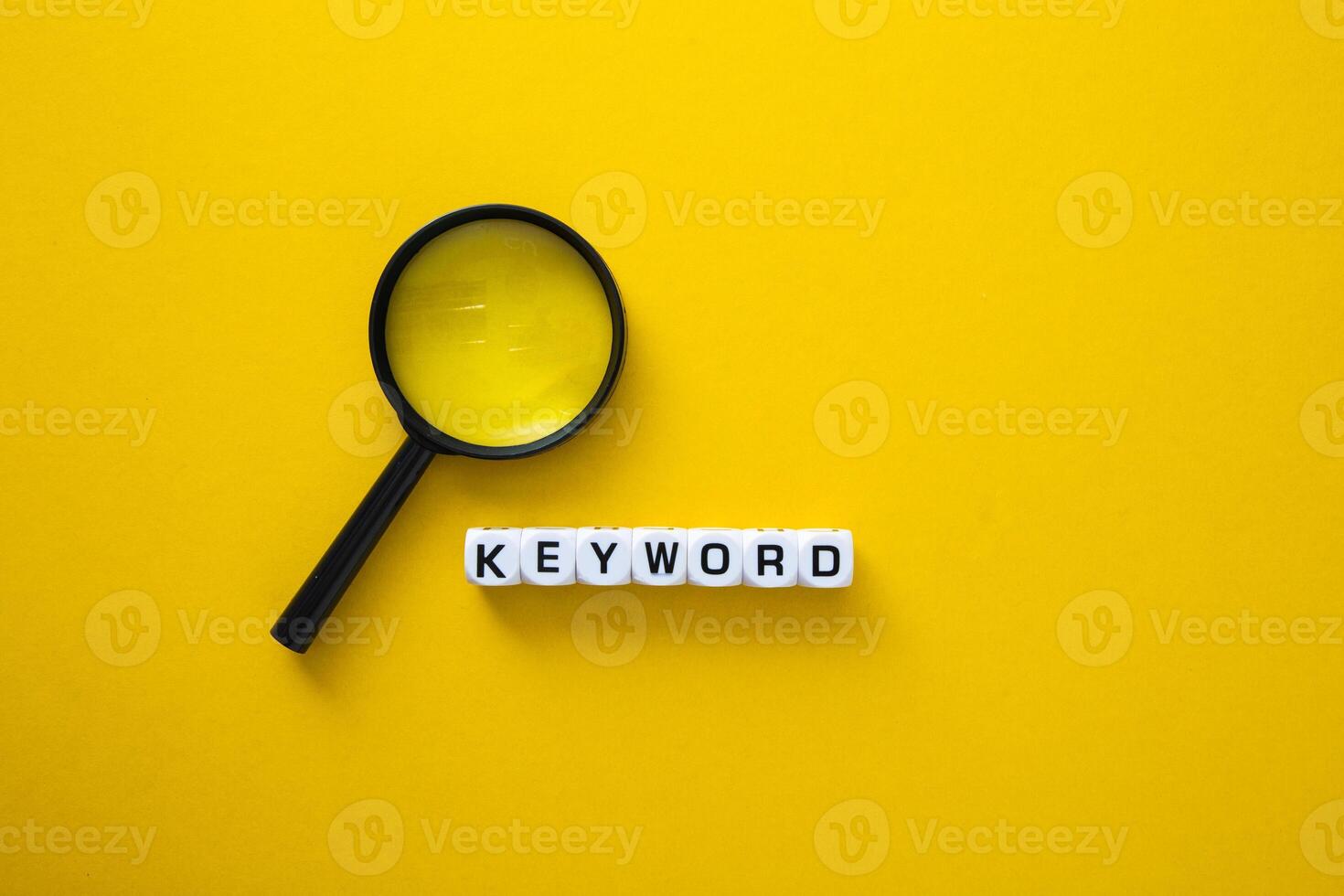 Block of Keyword on yellow background. Conceptual image of the importance of the keywords. photo