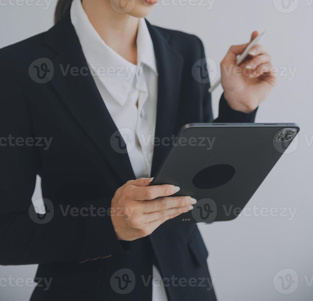 Beautiful female call center operator working on computer in office photo