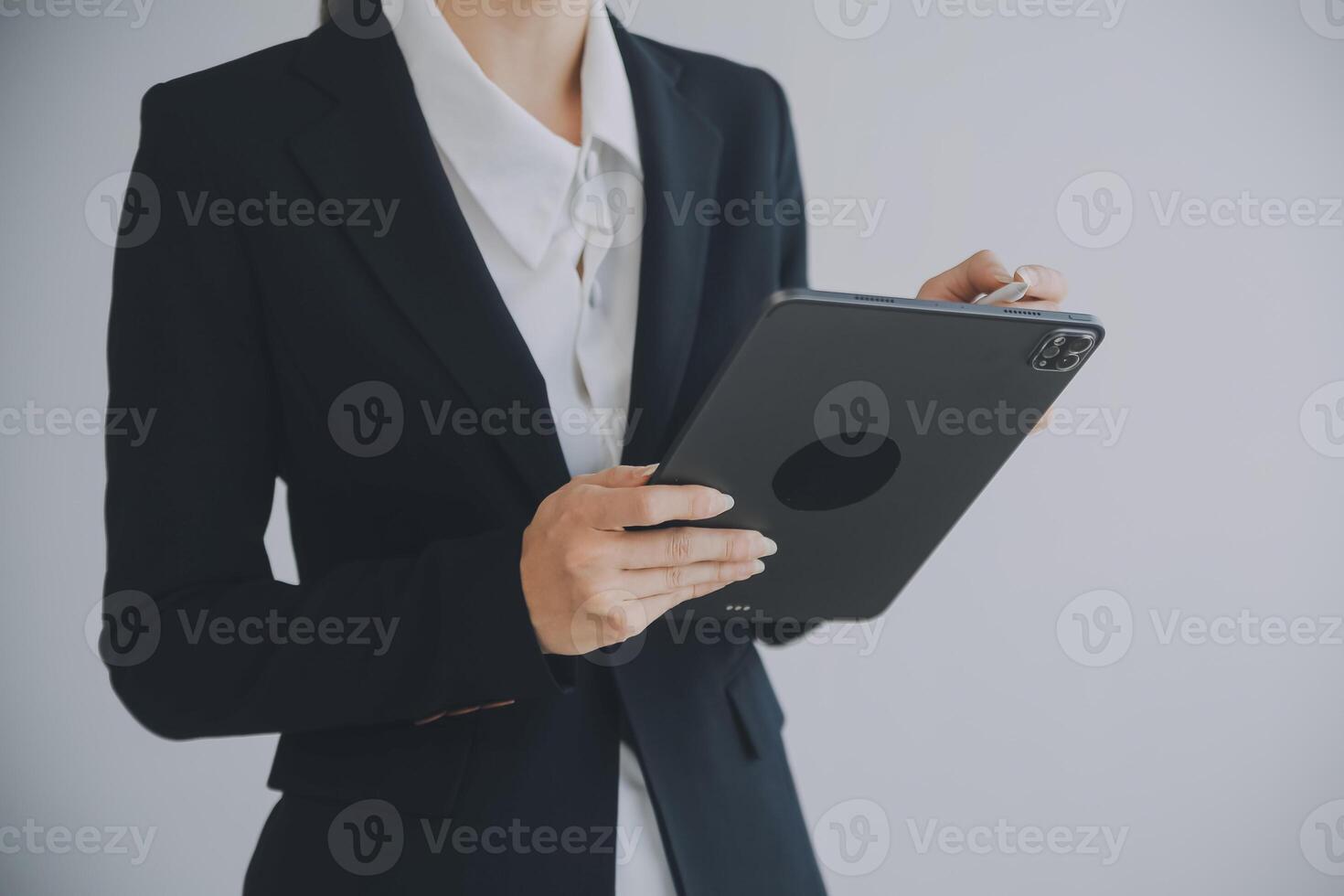 Beautiful female call center operator working on computer in office photo