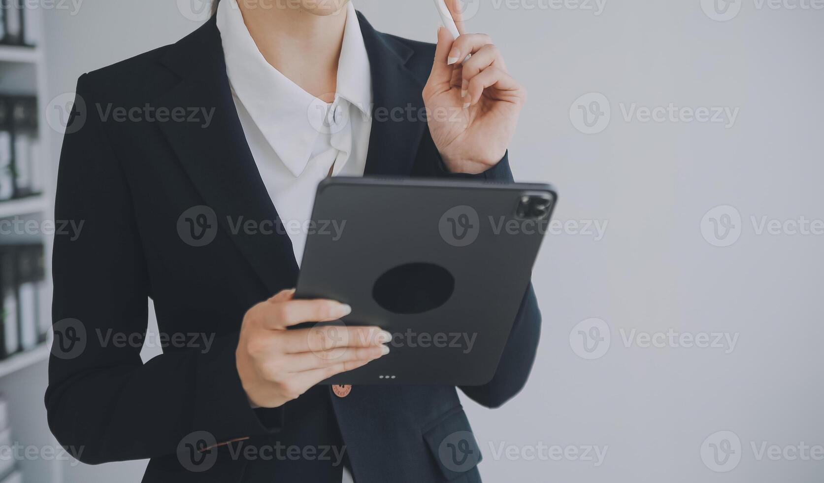 Beautiful female call center operator working on computer in office photo