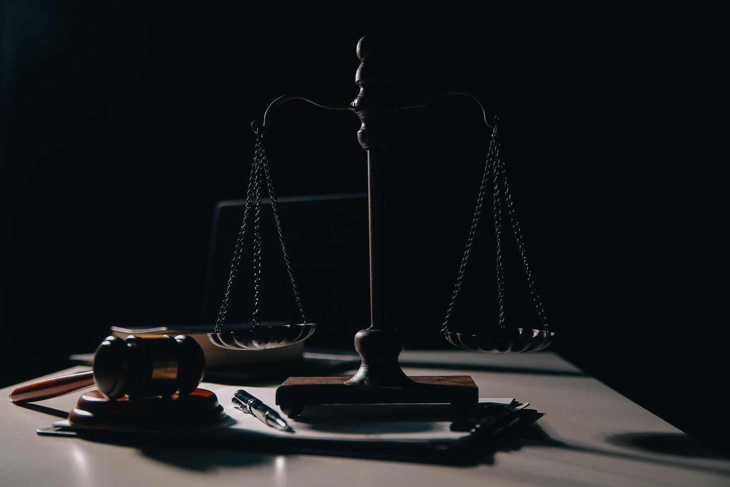 Business and lawyers discussing contract papers with brass scale on desk in office. Law, legal services, advice, justice and law concept picture with film grain effect photo