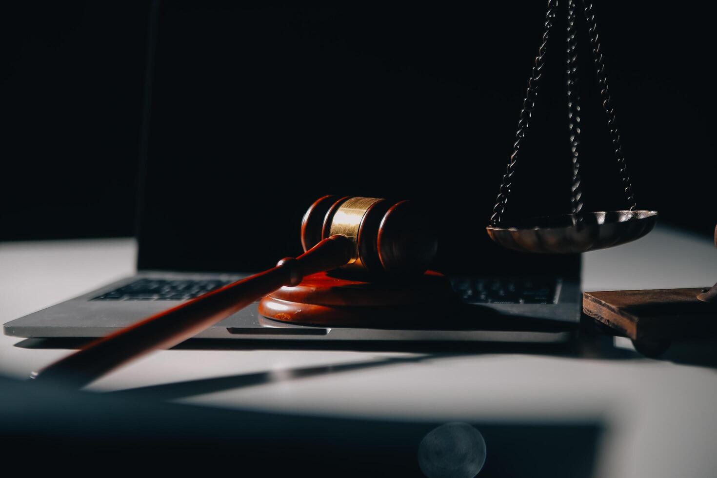 Business and lawyers discussing contract papers with brass scale on desk in office. Law, legal services, advice, justice and law concept picture with film grain effect photo