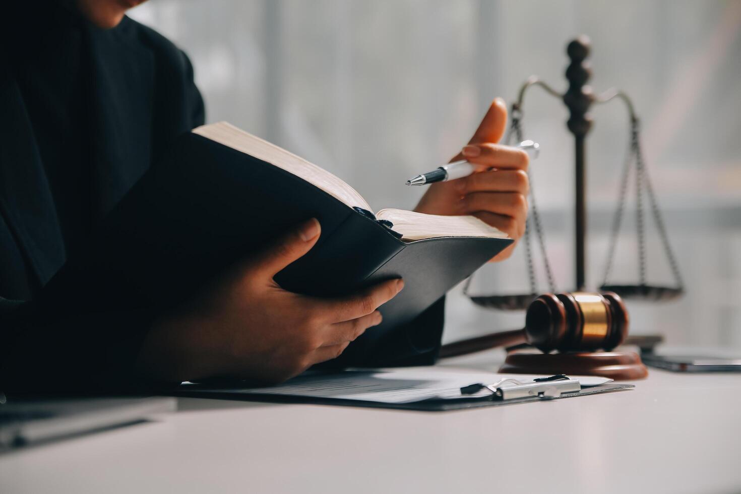 female lawyers working at the law firms. Judge gavel with scales of justice. Legal law, lawyer, advice and justice concept. photo