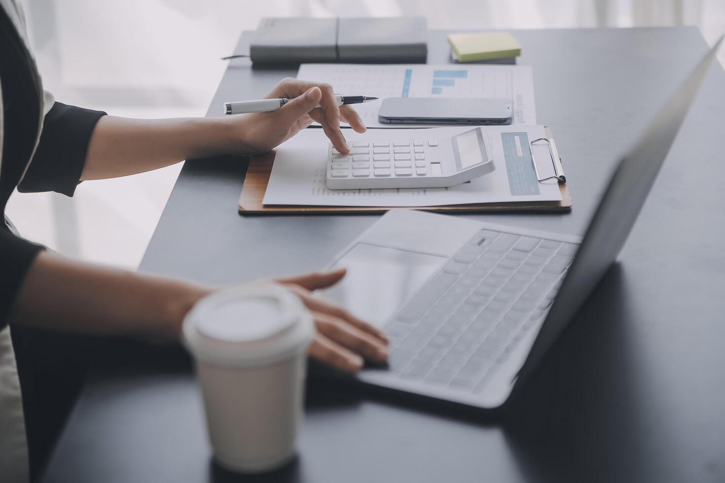 Financial analysts analyze business financial reports on a digital tablet planning investment project during a discussion at a meeting of corporate showing the results of their successful teamwork. photo