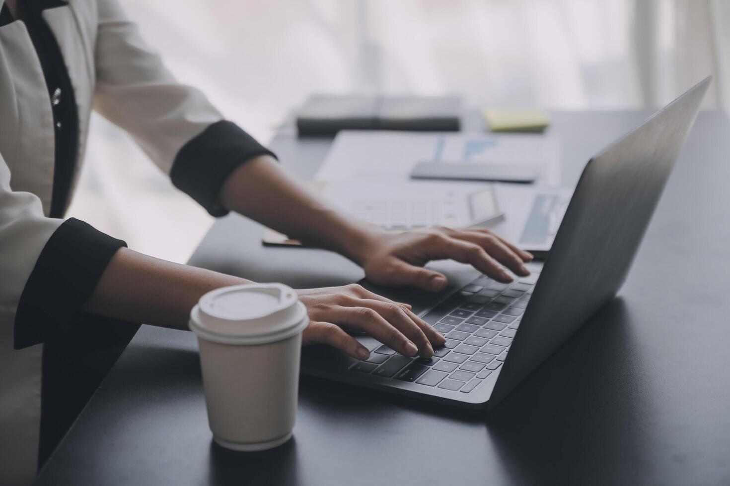 Financial analysts analyze business financial reports on a digital tablet planning investment project during a discussion at a meeting of corporate showing the results of their successful teamwork. photo
