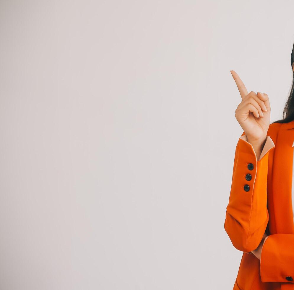 Asian Business woman using calculator and laptop for doing math finance on an office desk, tax, report, accounting, statistics, and analytical research concept photo