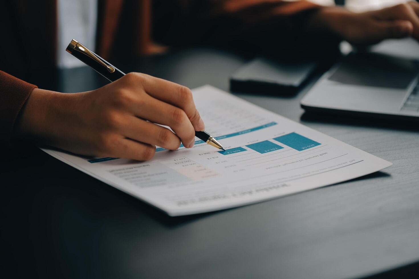 Asian Business woman using calculator and laptop for doing math finance on an office desk, tax, report, accounting, statistics, and analytical research concept photo