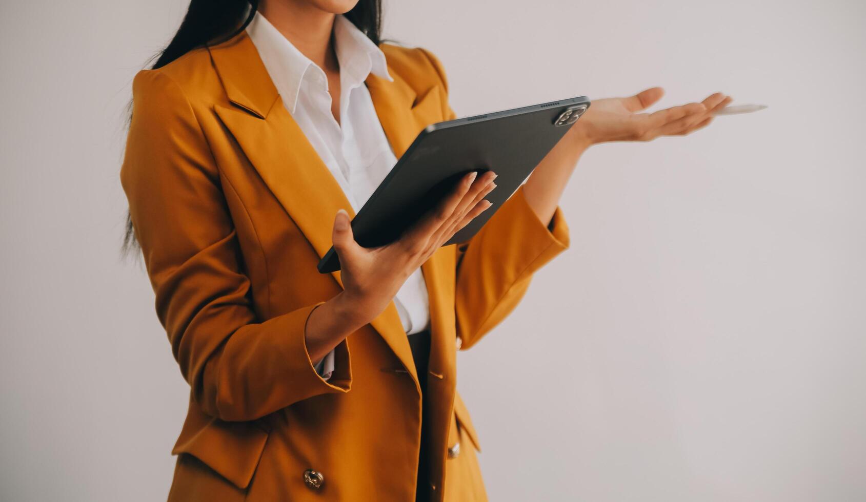Asian Business woman using calculator and laptop for doing math finance on an office desk, tax, report, accounting, statistics, and analytical research concept photo
