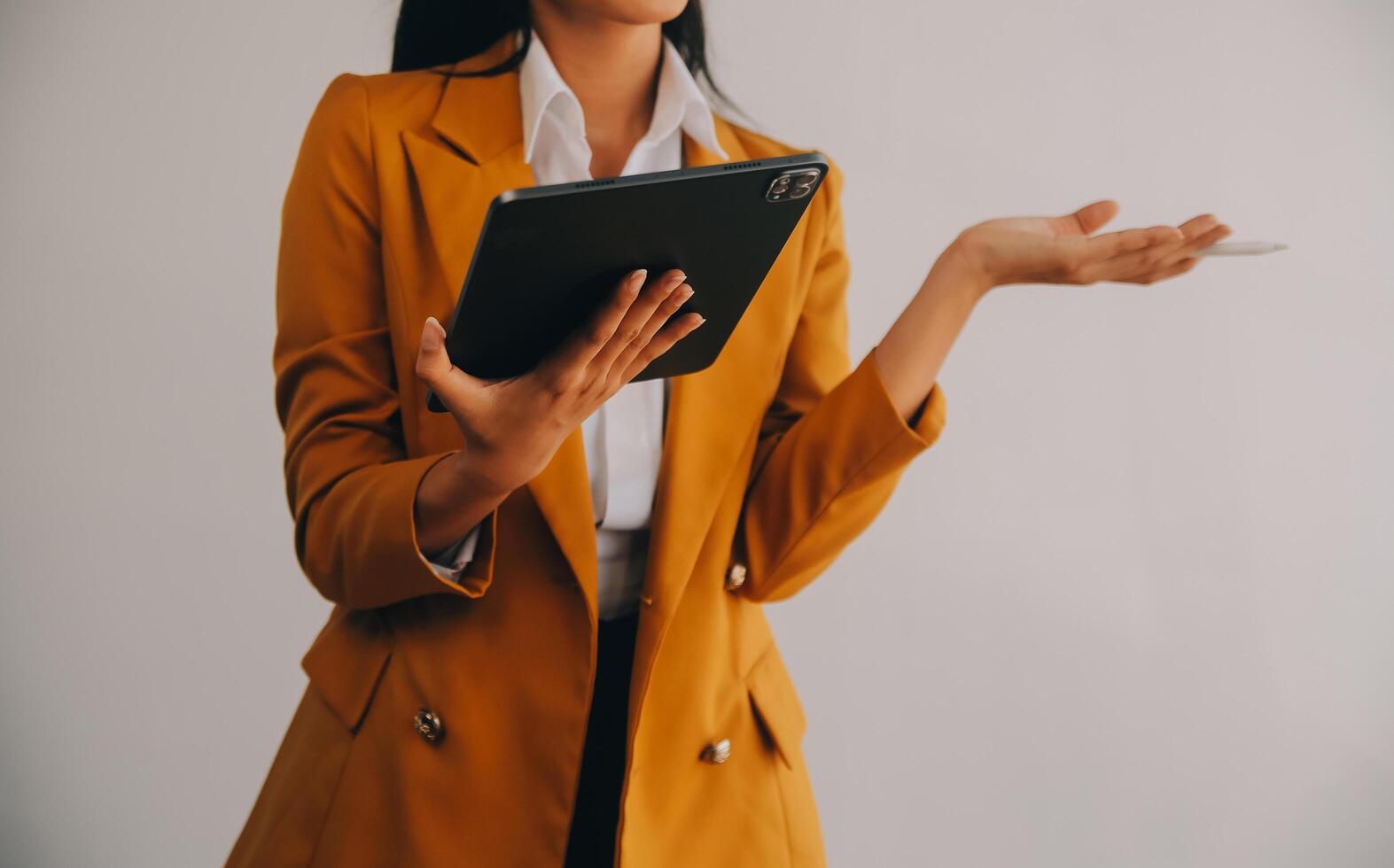 Asian Business woman using calculator and laptop for doing math finance on an office desk, tax, report, accounting, statistics, and analytical research concept photo