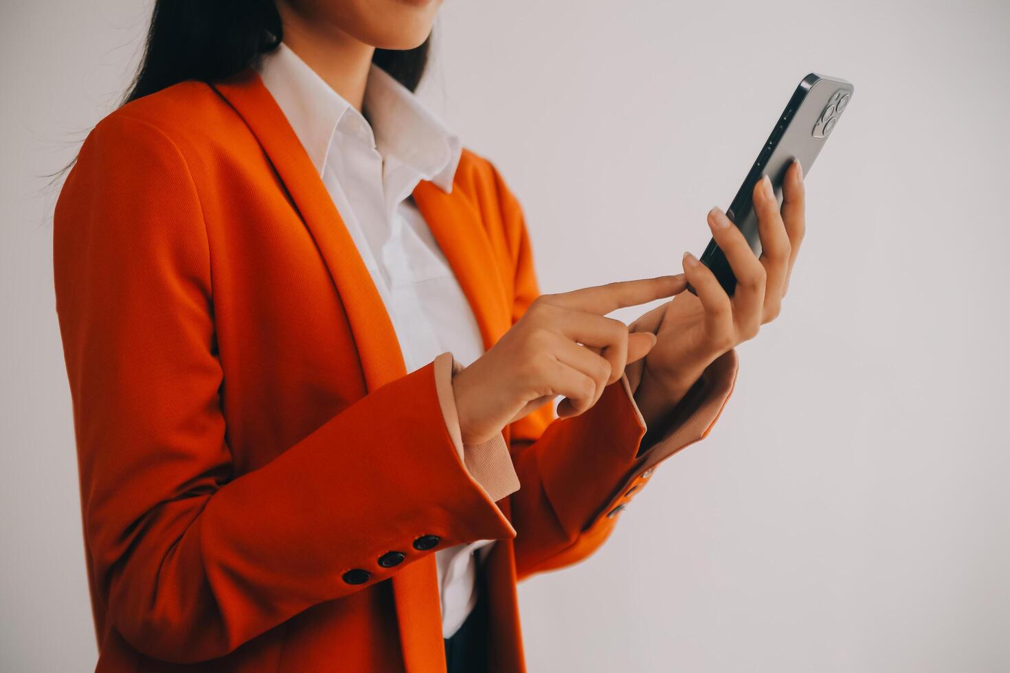 Asian Business woman using calculator and laptop for doing math finance on an office desk, tax, report, accounting, statistics, and analytical research concept photo