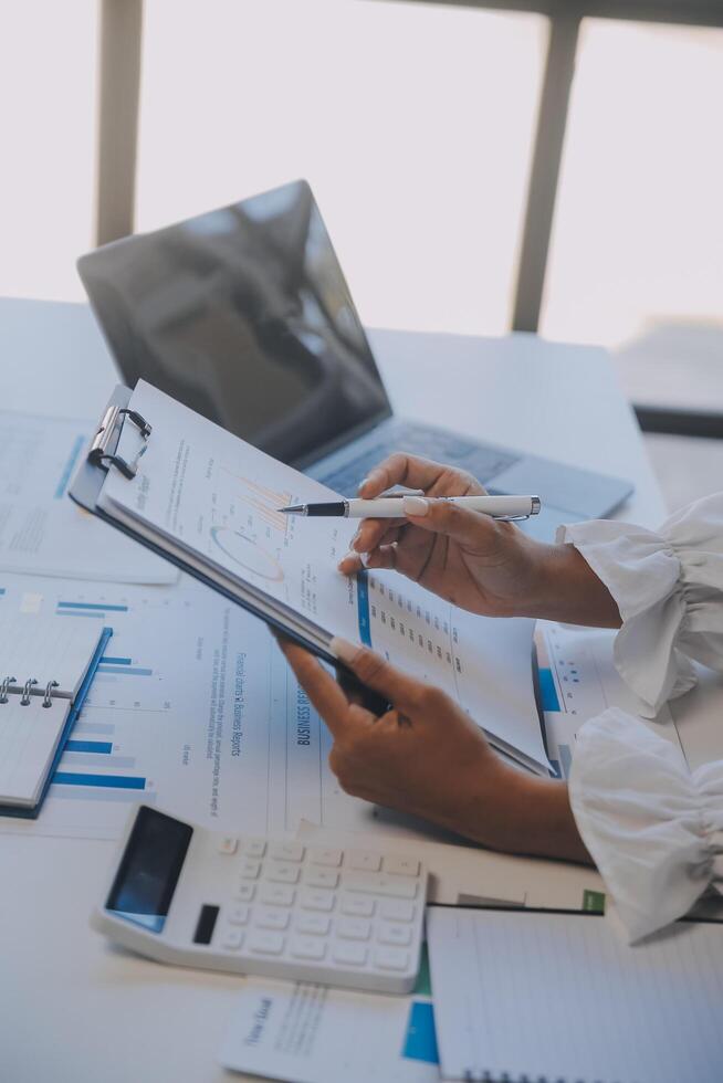 Co working conference, Business team meeting present, investor executive colleagues discussing new plan financial graph data on outdoors office table with laptop and tablet, Finance, accounting photo