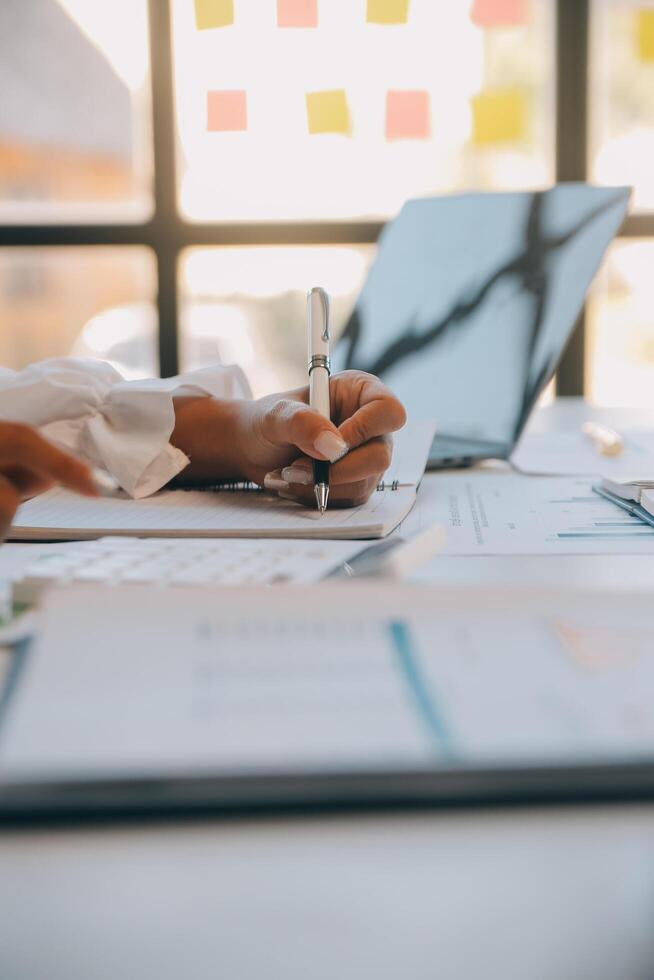 Co working conference, Business team meeting present, investor executive colleagues discussing new plan financial graph data on outdoors office table with laptop and tablet, Finance, accounting photo