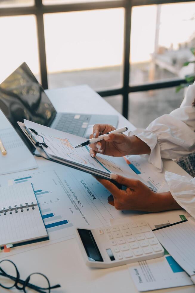 Co working conference, Business team meeting present, investor executive colleagues discussing new plan financial graph data on outdoors office table with laptop and tablet, Finance, accounting photo