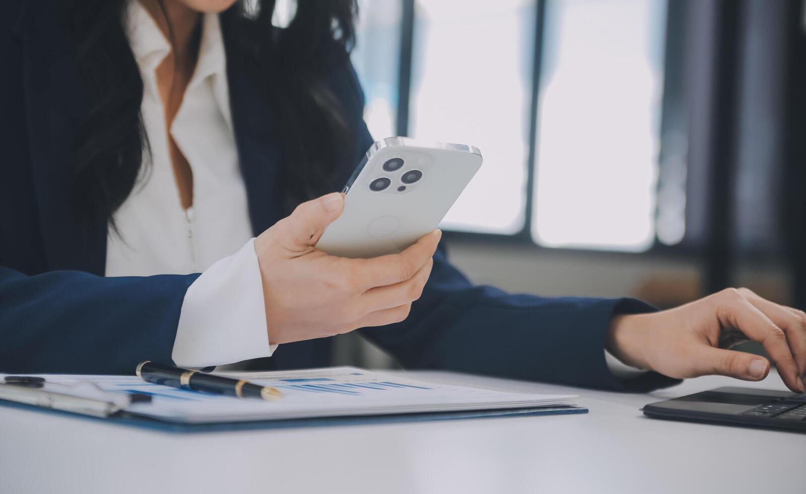 Financial analysts analyze business financial reports on a digital tablet planning investment project during a discussion at a meeting of corporate showing the results of their successful teamwork. photo