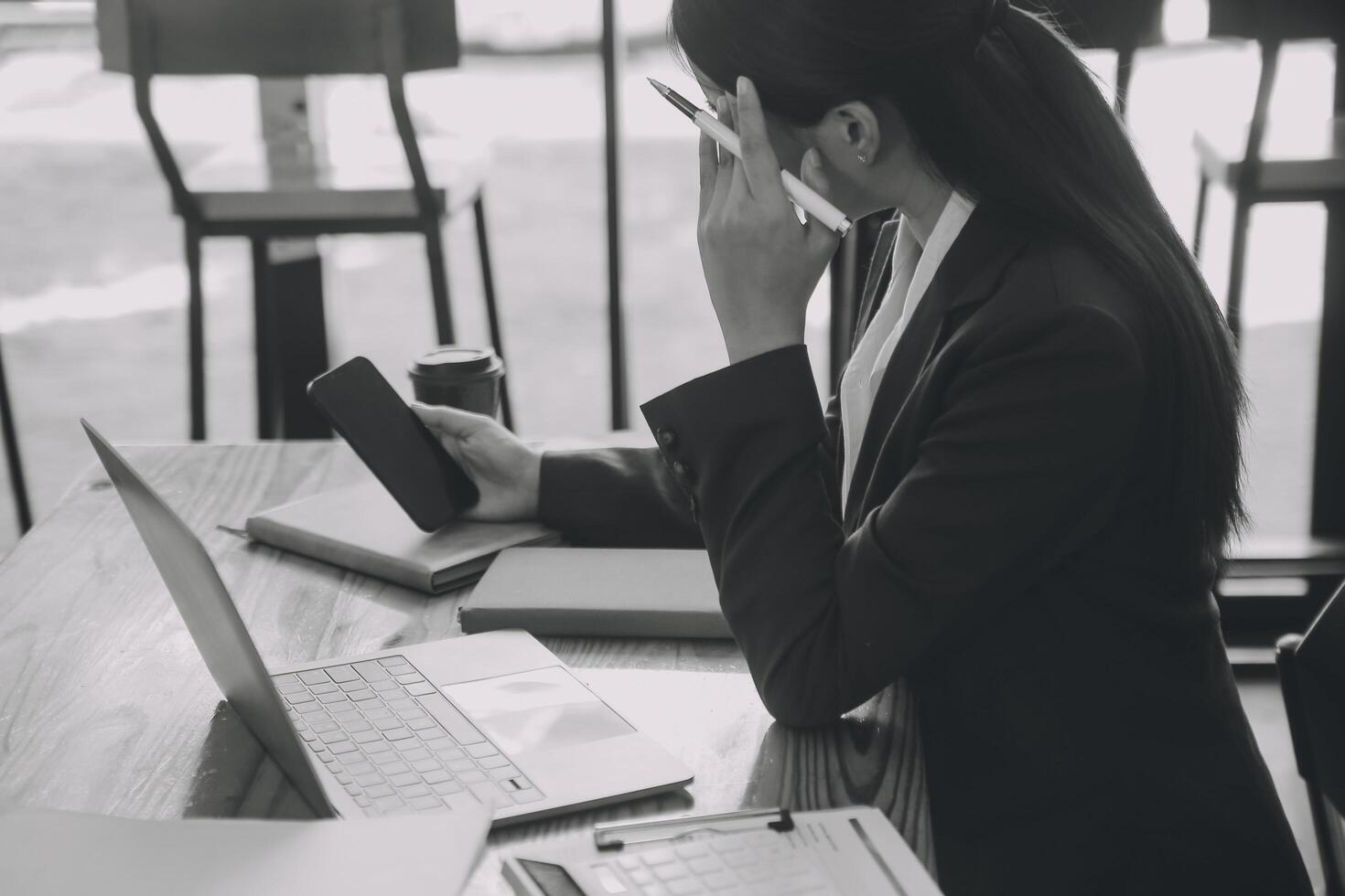 Asian women are stressed while working on laptop, Tired asian businesswoman with headache at office, feeling sick at work, copy space photo