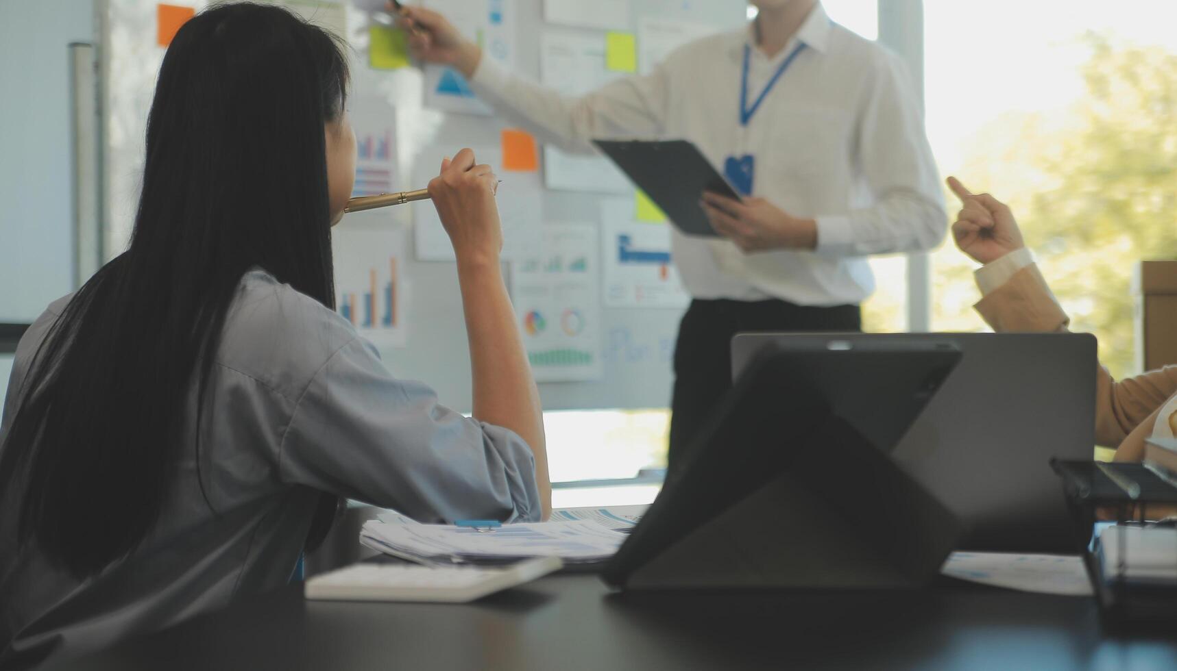 Business team collaboration discussing working analyzing with financial data and marketing growth report graph in team, presentation and brainstorming to strategy planning making profit of company. photo