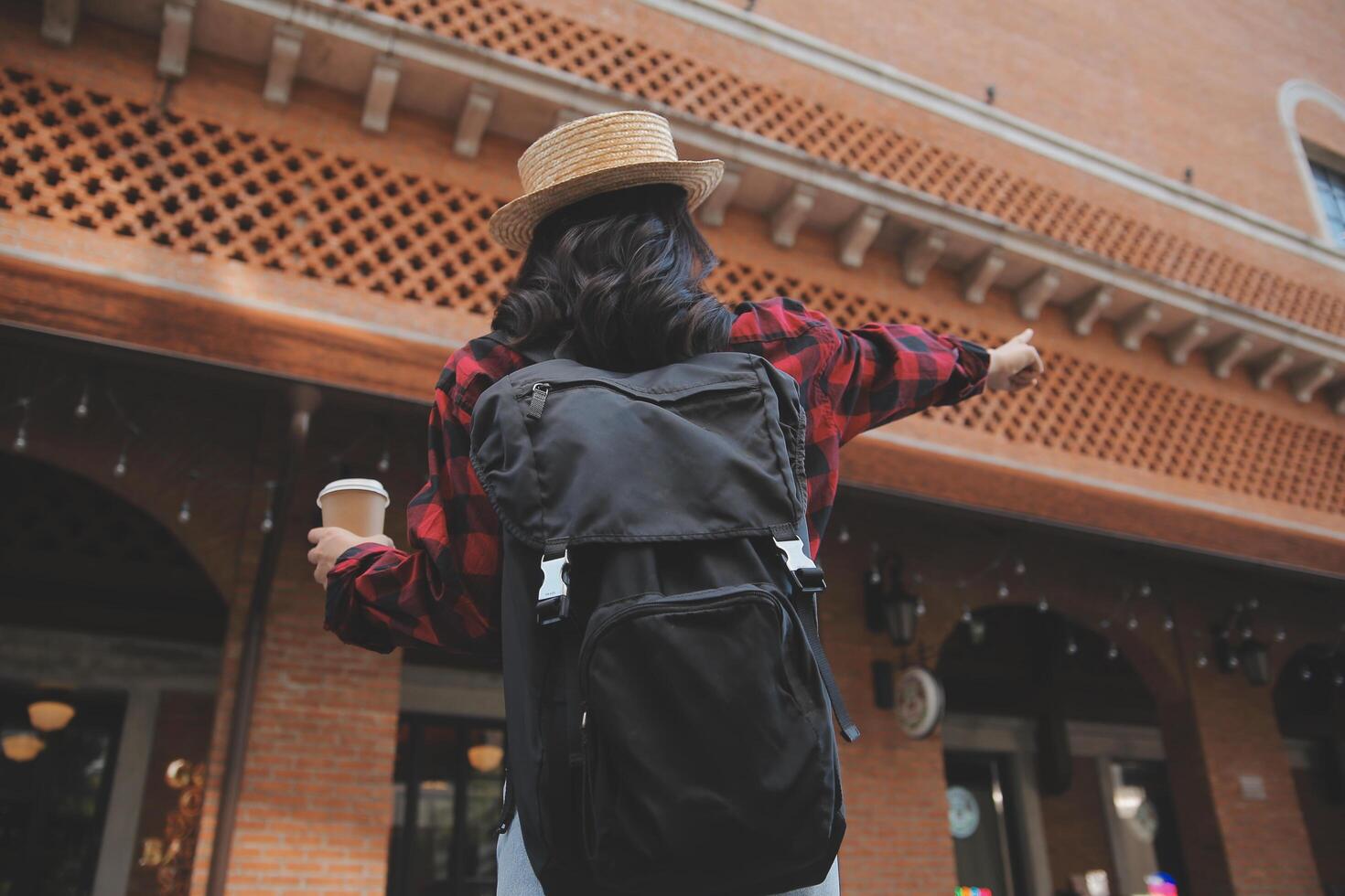 Woman travel around the world with backpack freedom and relax life concept. photo