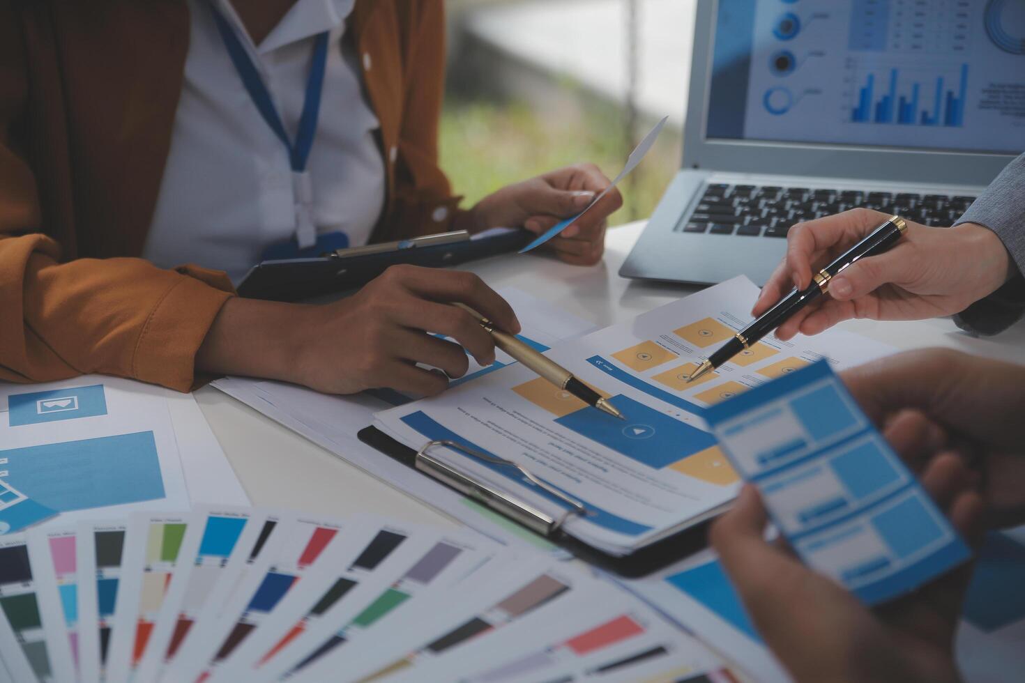 Close up ux developer and ui designer use augmented reality brainstorming about mobile app interface wireframe design on desk at modern office.Creative digital development agency photo