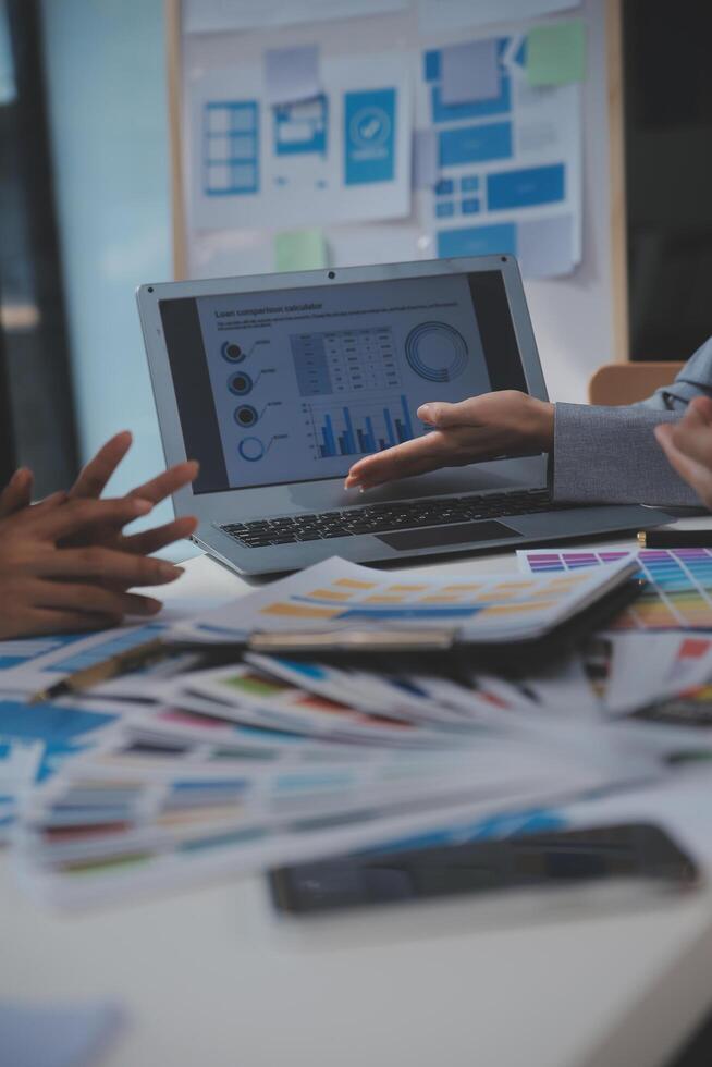 Close up ux developer and ui designer use augmented reality brainstorming about mobile app interface wireframe design on desk at modern office.Creative digital development agency photo